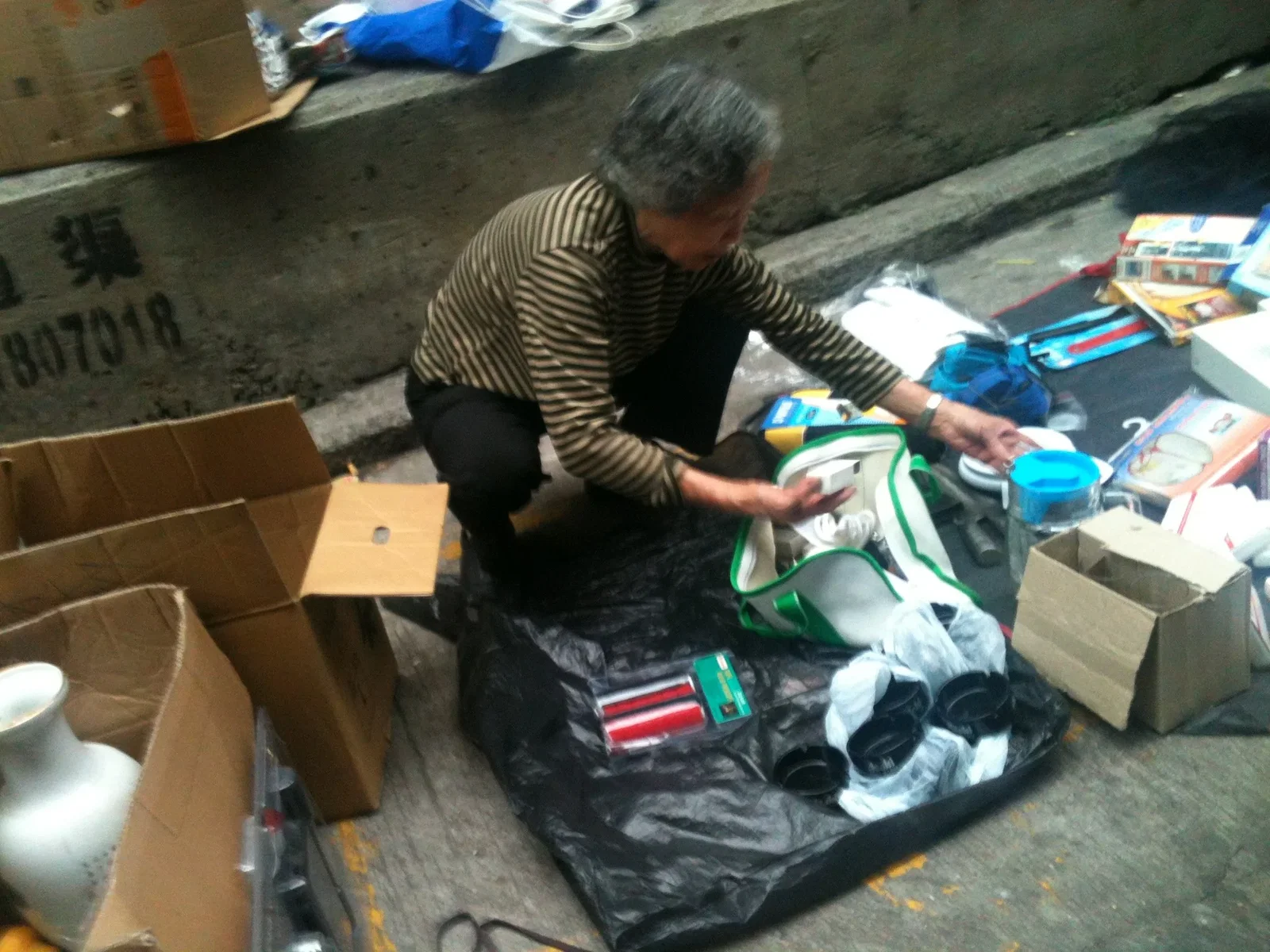 Woman in her 70s selling trinkets