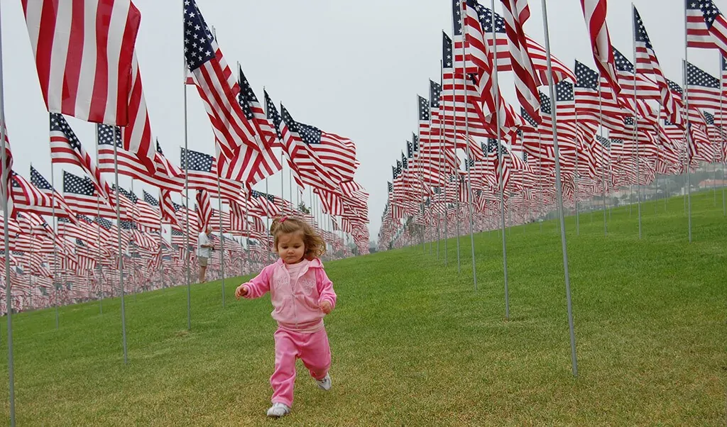 kid-running-us-flags.jpg