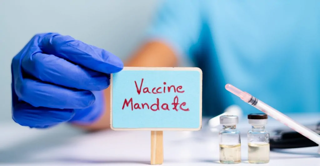 Rhode Island: Mandatory Vax or Pay Double Your Income Tax